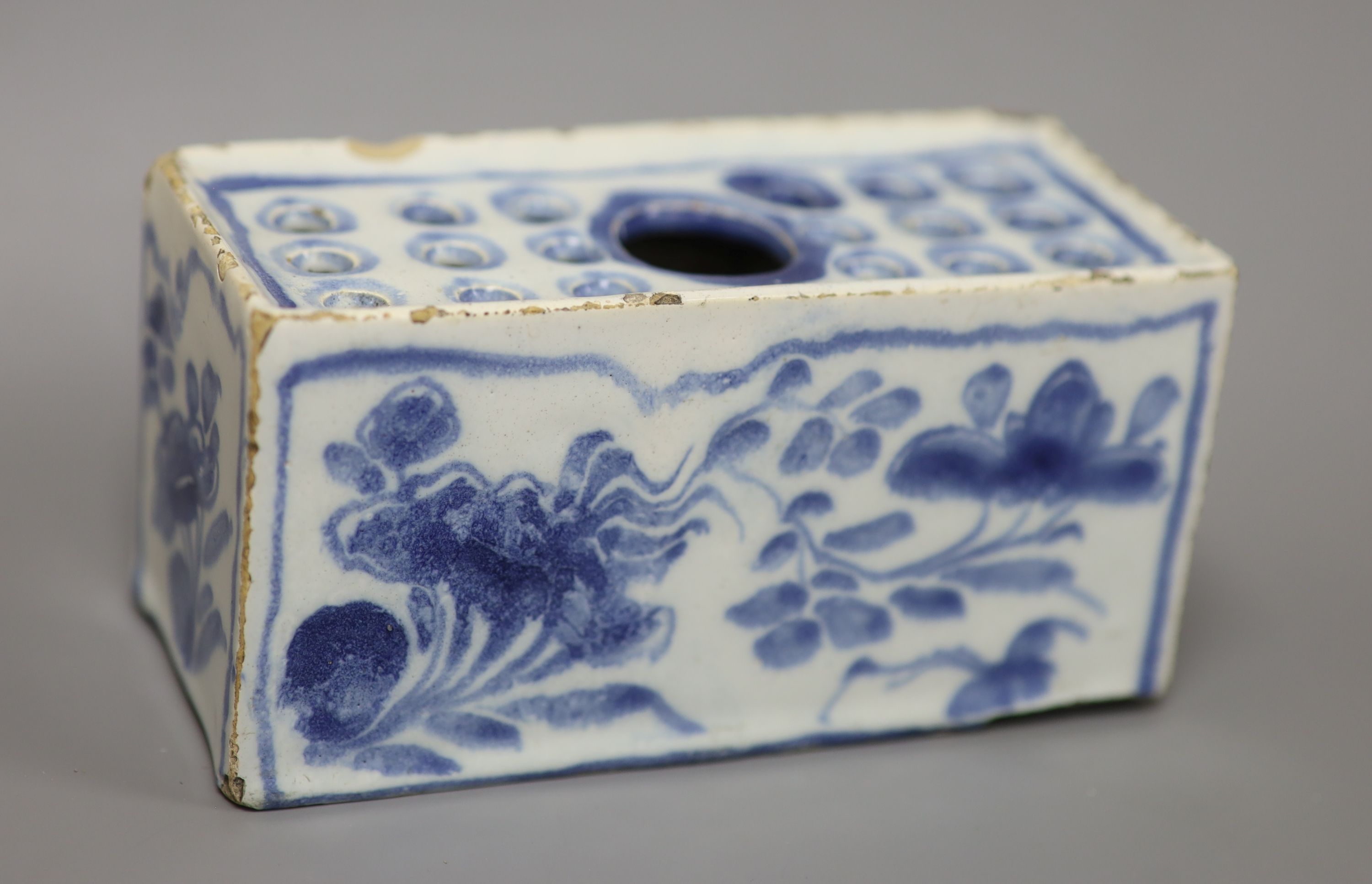 An 18th century Delft ware flower brick, length 12.5cm